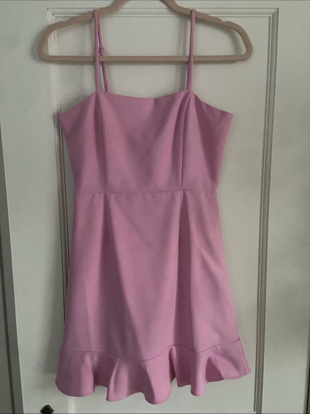 Light pink spaghetti strap dress, ruffle hem, feminine chic, flirty minimalism